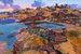 A peaceful scene of a building by some water, taken in No Man's Sky.